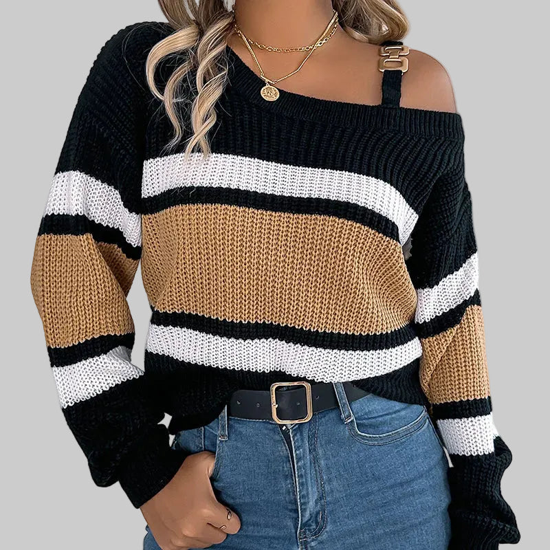 Solira black, beige, and white striped sweater worn by a person with a neutral background